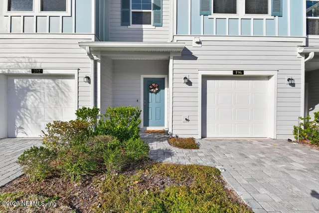 a view of a house with a potted plant