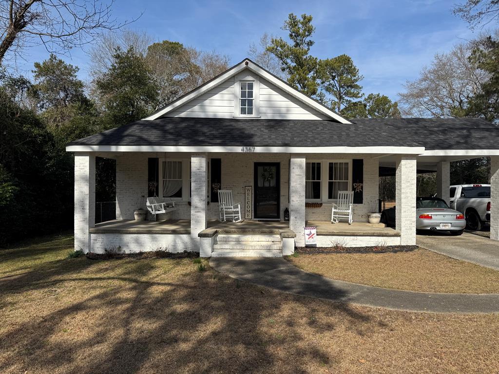 4367 Old Macon Road Columbus, GA 31907 - Photo 1 of 32 a view of a house with sitting area and garden