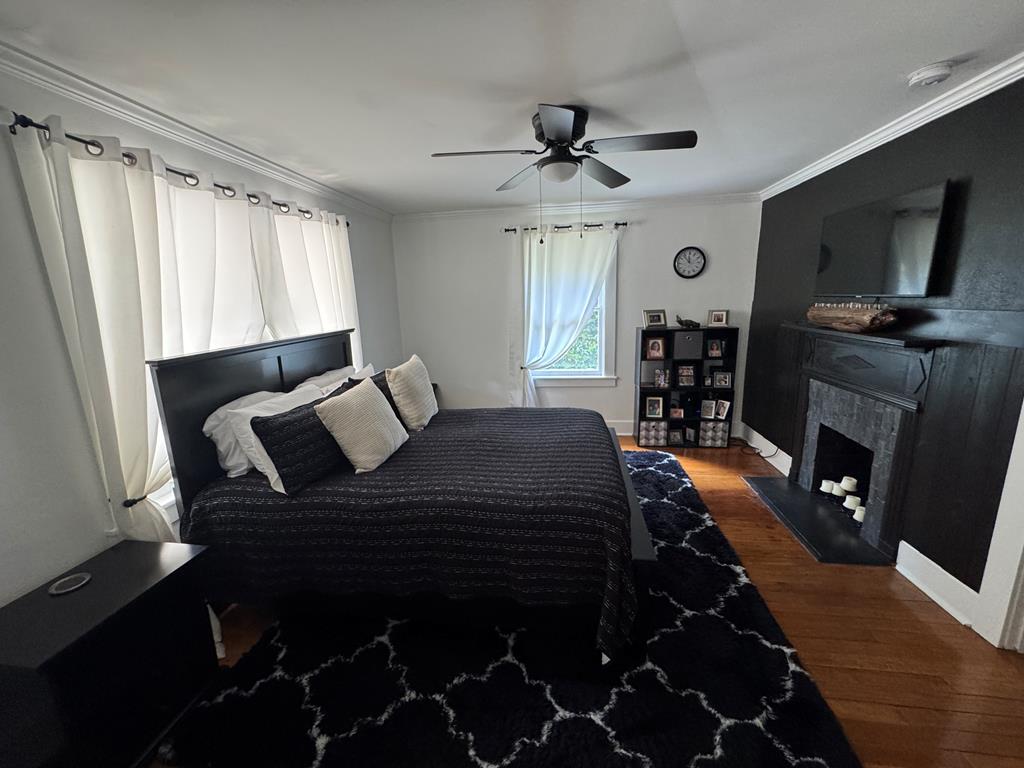 4367 Old Macon Road Columbus, GA 31907 - Photo 15 of 32 a bedroom with a bed and wooden floor