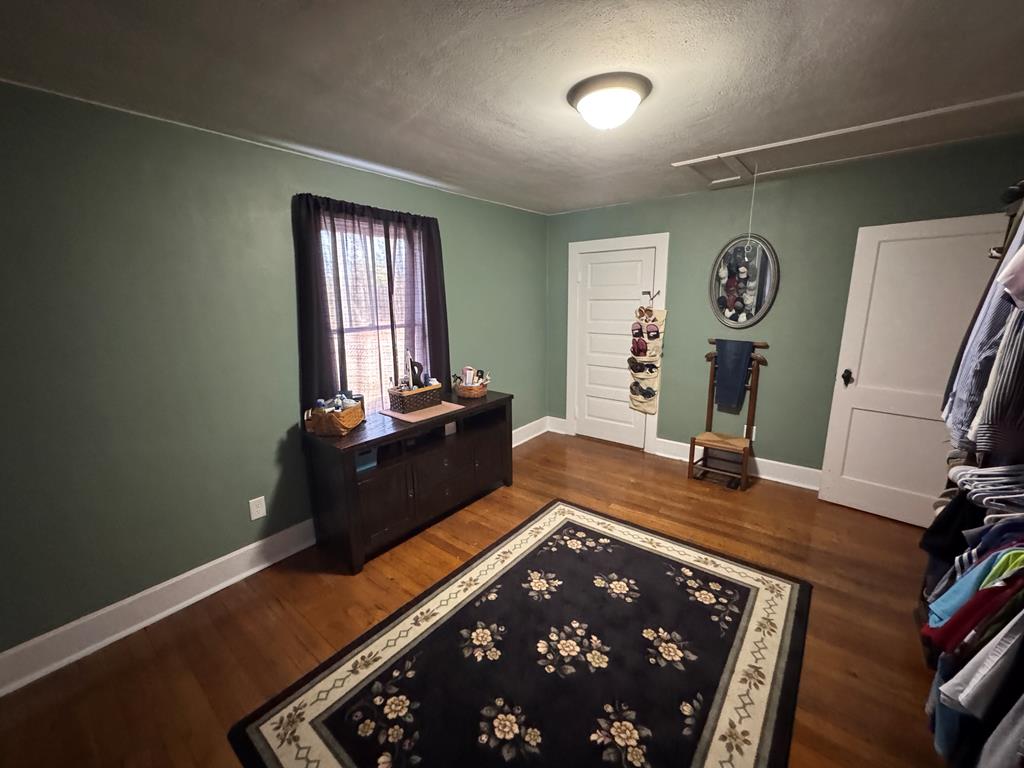 4367 Old Macon Road Columbus, GA 31907 - Photo 20 of 32 a room with furniture and wooden floor