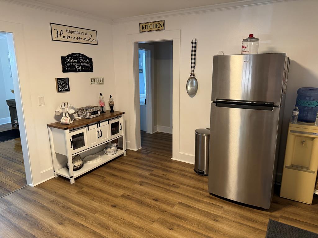 4367 Old Macon Road Columbus, GA 31907 - Photo 25 of 32 a kitchen with stainless steel appliances a refrigerator and wooden floor