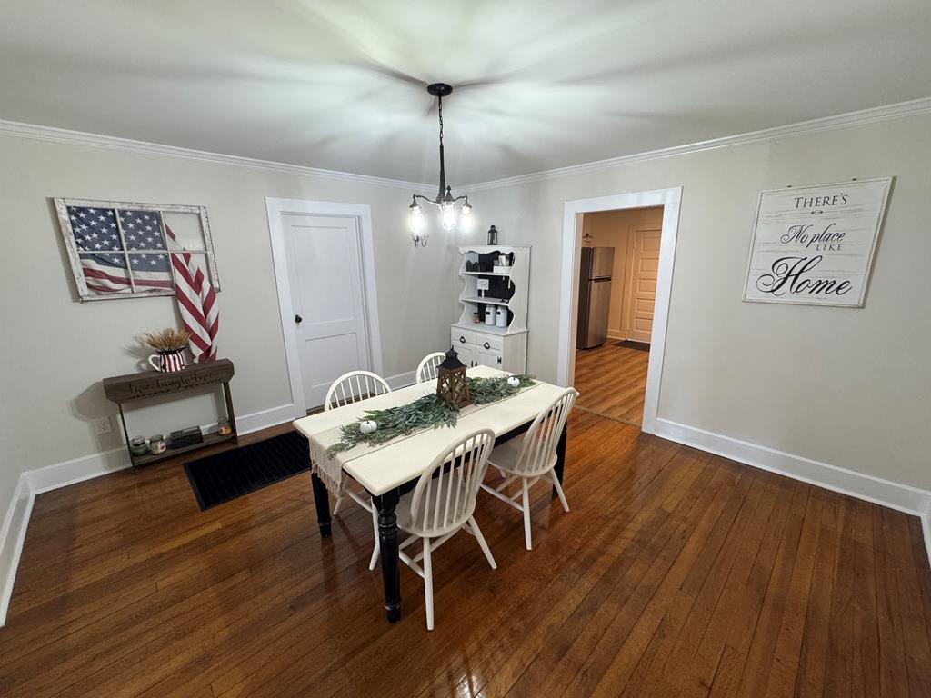 4367 Old Macon Road Columbus, GA 31907 - Photo 29 of 32 a view of a dining room with furniture and wooden floor