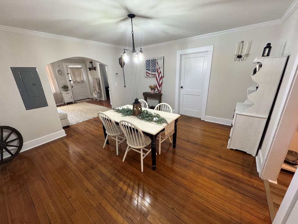 4367 Old Macon Road Columbus, GA 31907 - Photo 30 of 32 a view of a dining room with furniture wooden floor and a chandelier
