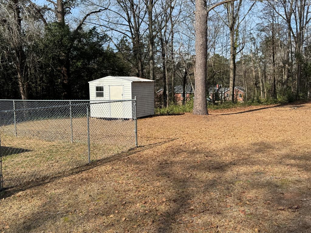4367 Old Macon Road Columbus, GA 31907 - Photo 8 of 32 a backyard of a house with lots of green space