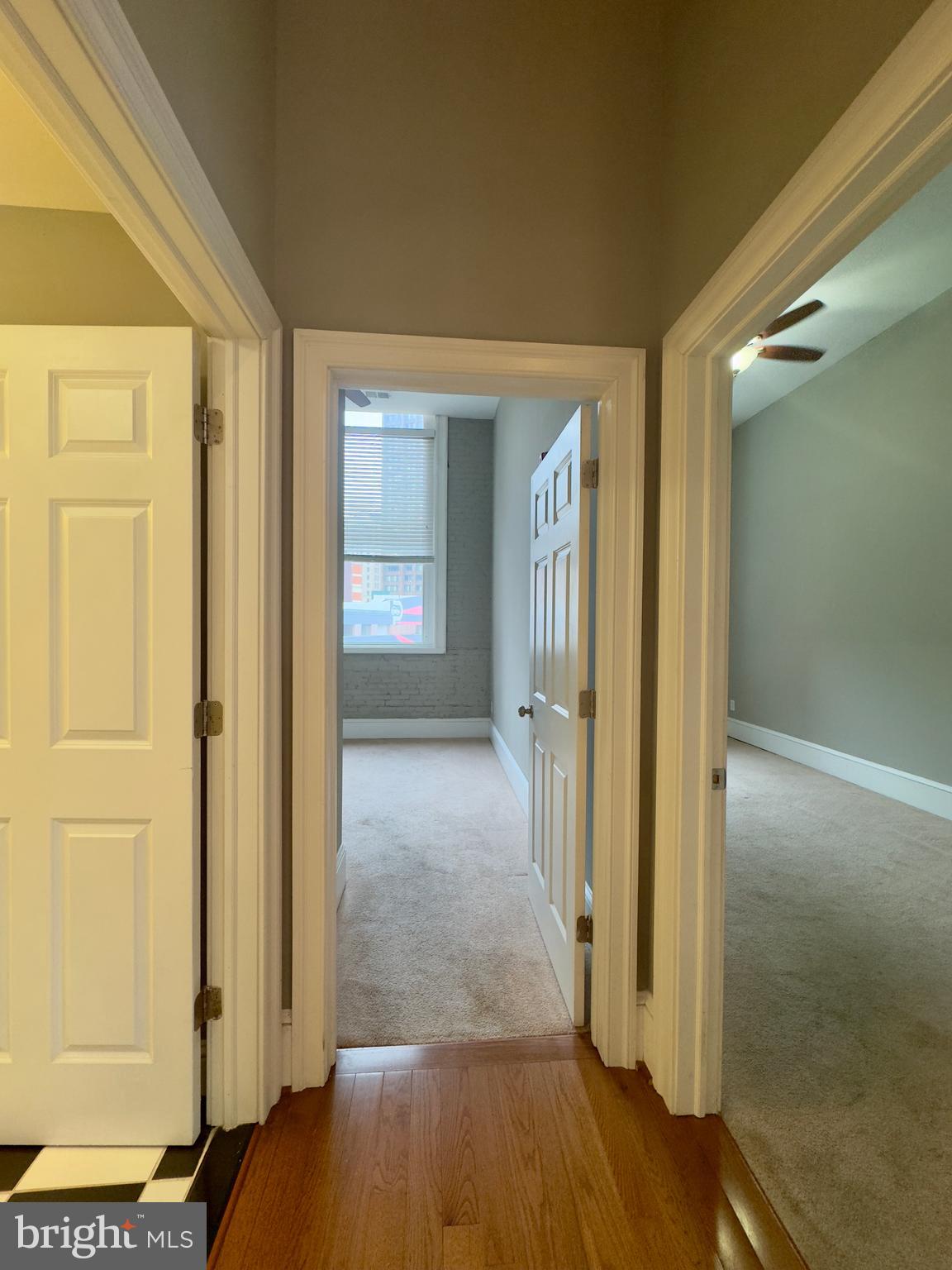 7 West Mulberry Street, Unit 7 Baltimore, MD 21201 - Photo 13 of 16 a view of a hallway with wooden floor