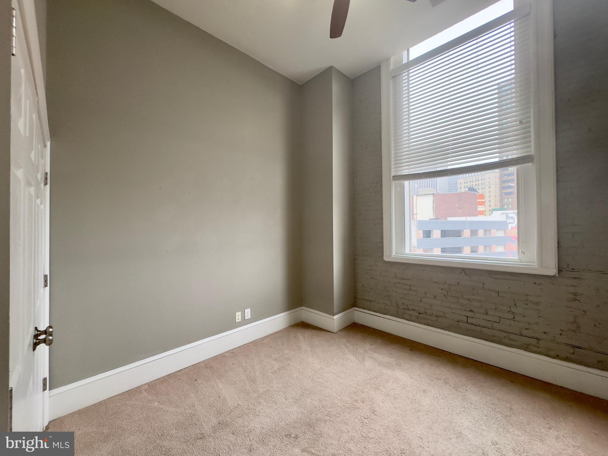 7 West Mulberry Street, Unit 7 Baltimore, MD 21201 - Photo 16 of 16 a view of an empty room with a window
