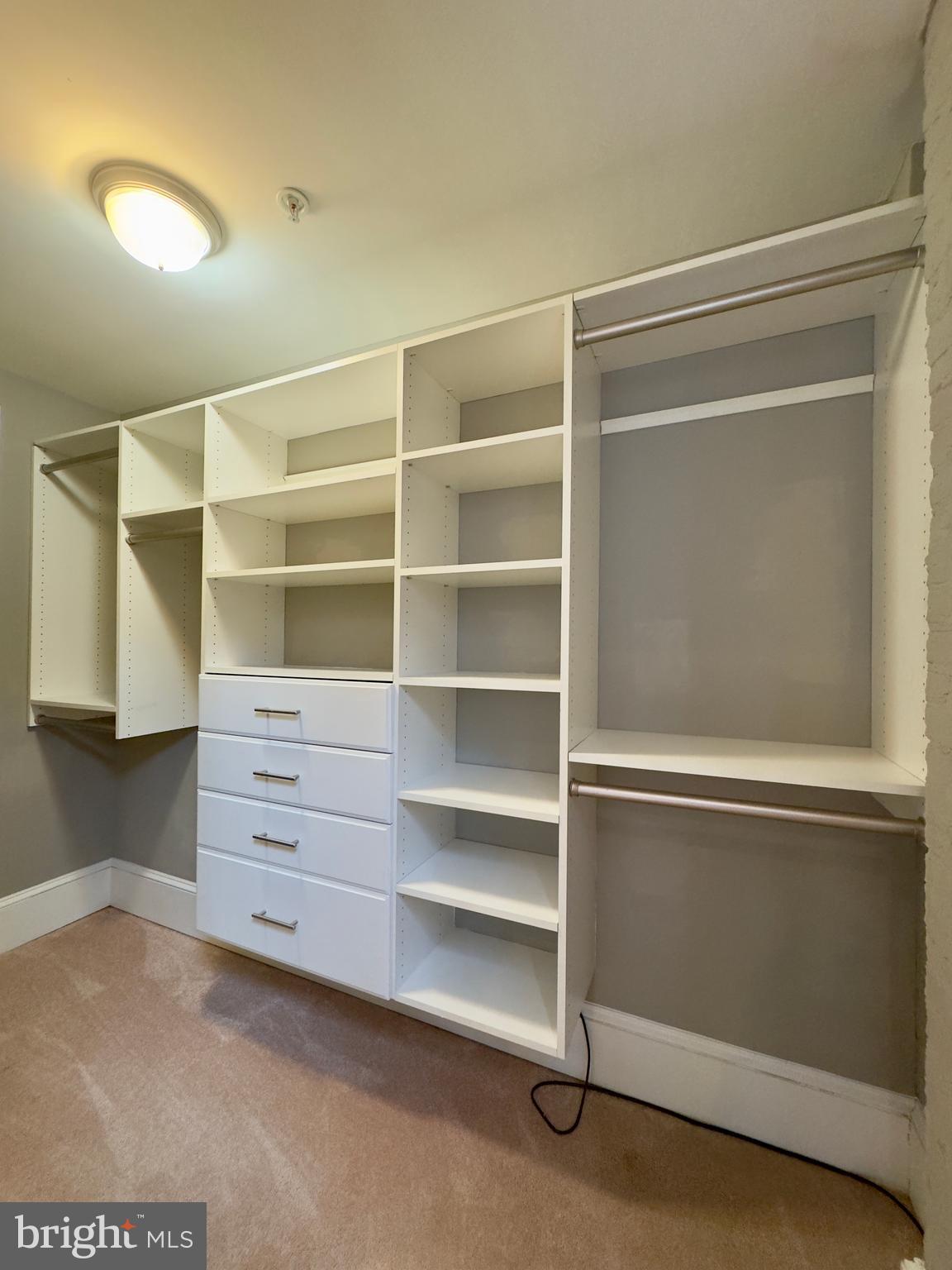 7 West Mulberry Street, Unit 7 Baltimore, MD 21201 - Photo 8 of 16 a view of walk in closet with empty racks