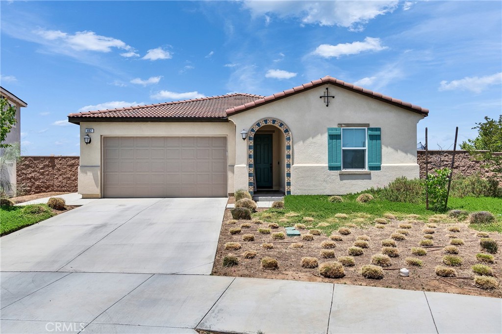 402 Appleton Way Perris, CA 92570 - Photo 1 of 34 a view of a house with a yard