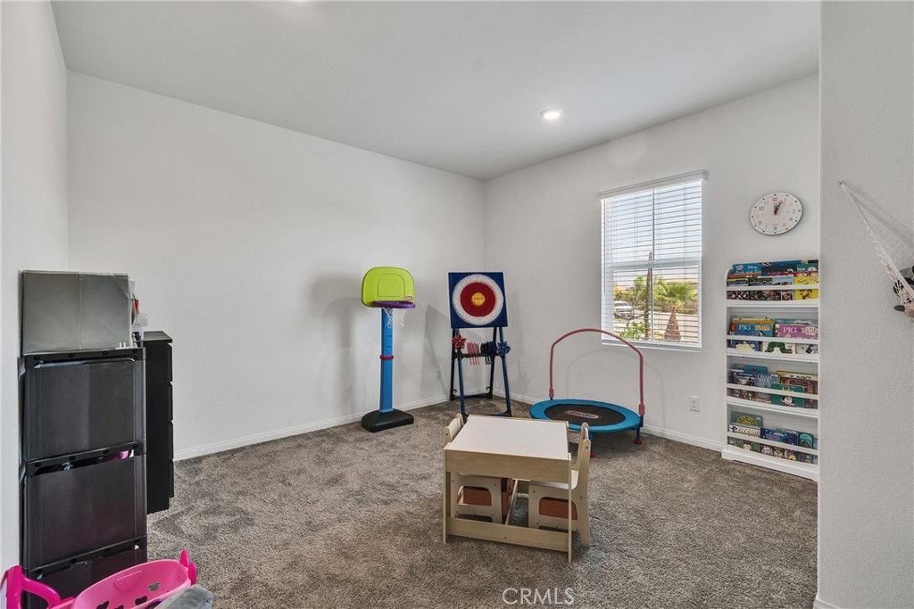 402 Appleton Way Perris, CA 92570 - Photo 13 of 34 a room with furniture and a window