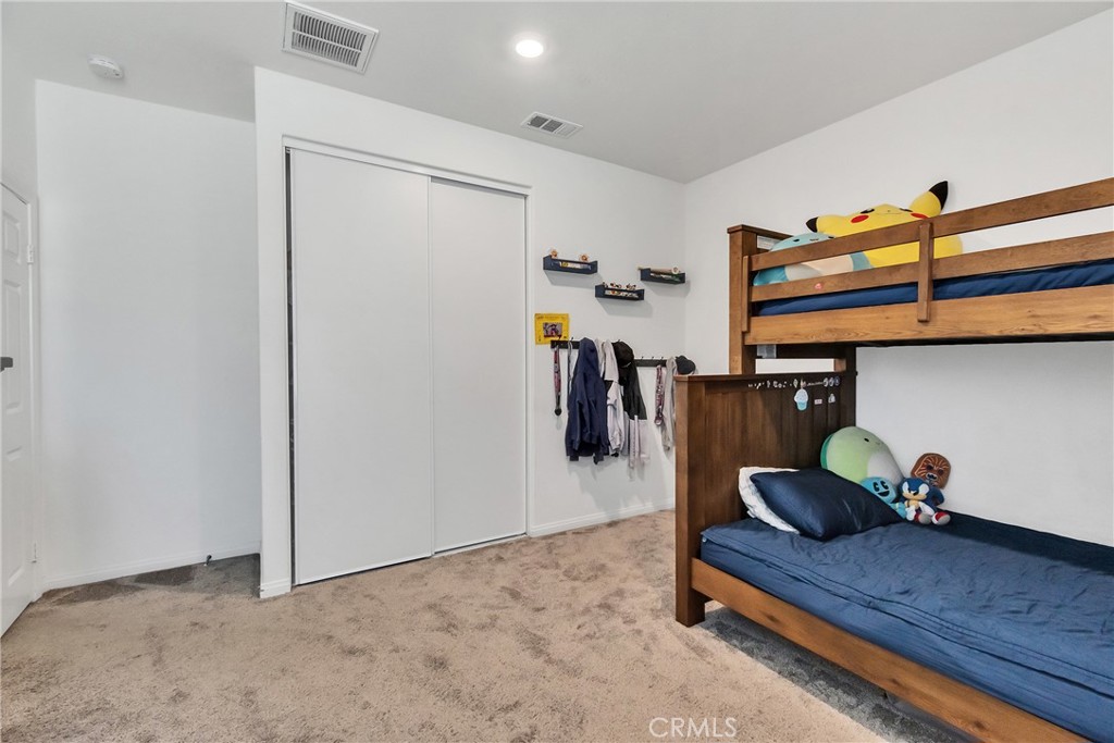 402 Appleton Way Perris, CA 92570 - Photo 17 of 34 a room with gym equipment and wooden floor
