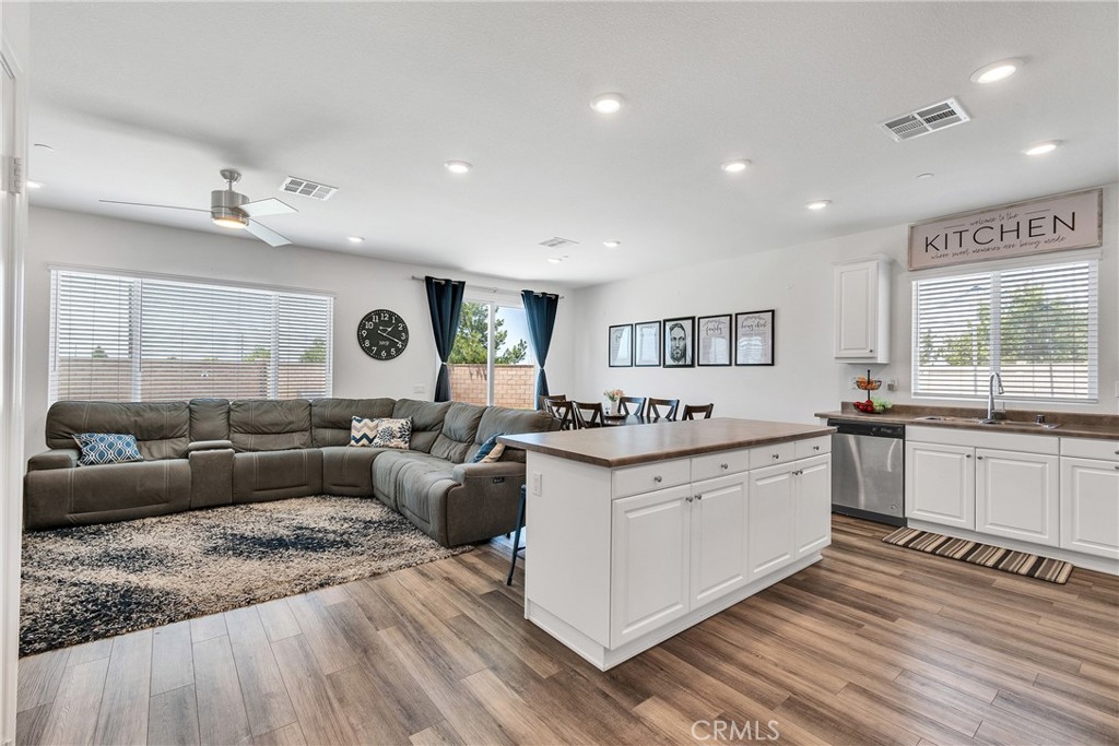 402 Appleton Way Perris, CA 92570 - Photo 24 of 34 a large white kitchen with a large window