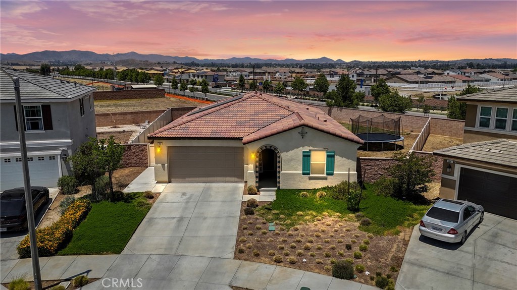 402 Appleton Way Perris, CA 92570 - Photo 3 of 34 a front view of a house with a yard