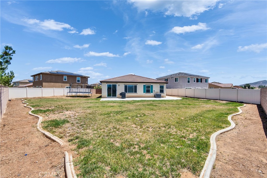 402 Appleton Way Perris, CA 92570 - Photo 32 of 34 a front view of a house with garden