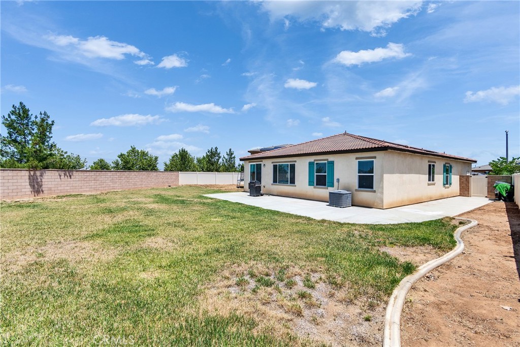 402 Appleton Way Perris, CA 92570 - Photo 33 of 34 a front view of a house with a garden