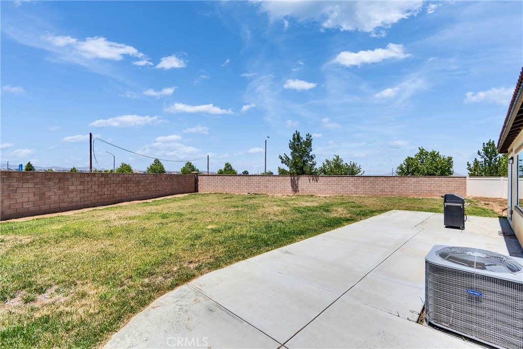 402 Appleton Way Perris, CA 92570 - Photo 34 of 34 a view of a yard with an trees and fence