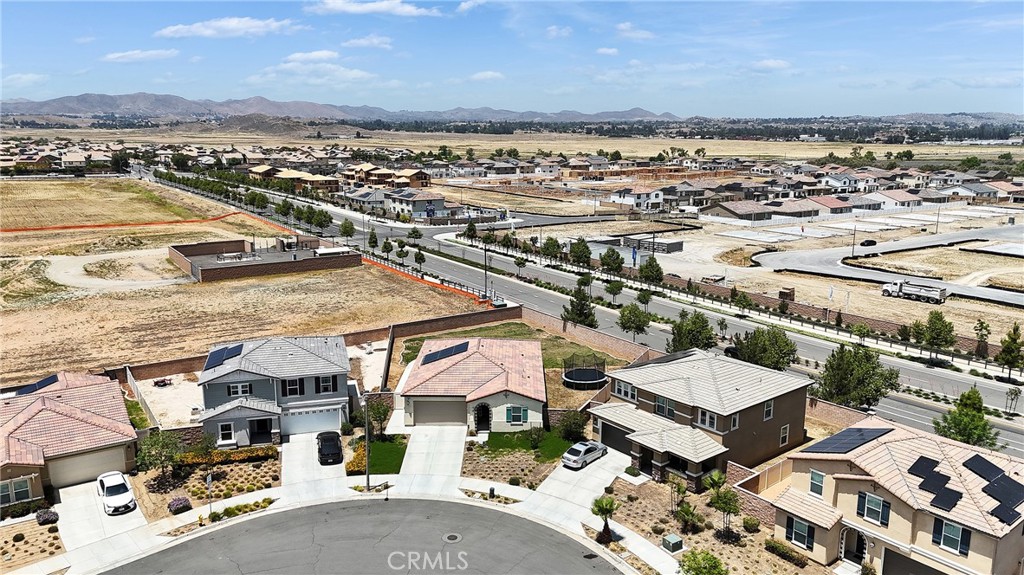402 Appleton Way Perris, CA 92570 - Photo 4 of 34 an aerial view of residential houses with outdoor space