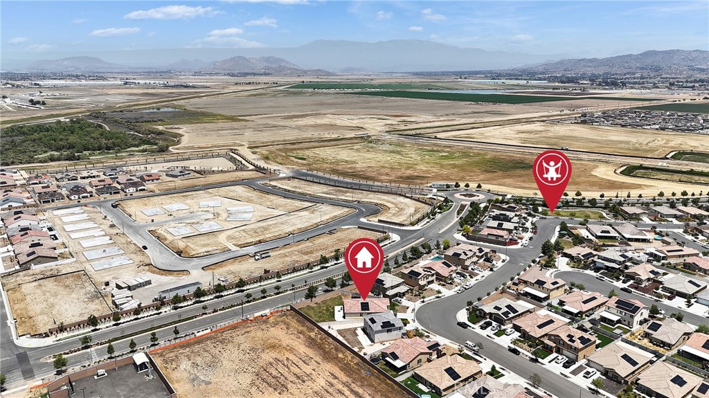 402 Appleton Way Perris, CA 92570 - Photo 7 of 34 a view of an ocean and a building