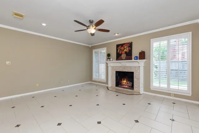 a view of an empty room with a fireplace