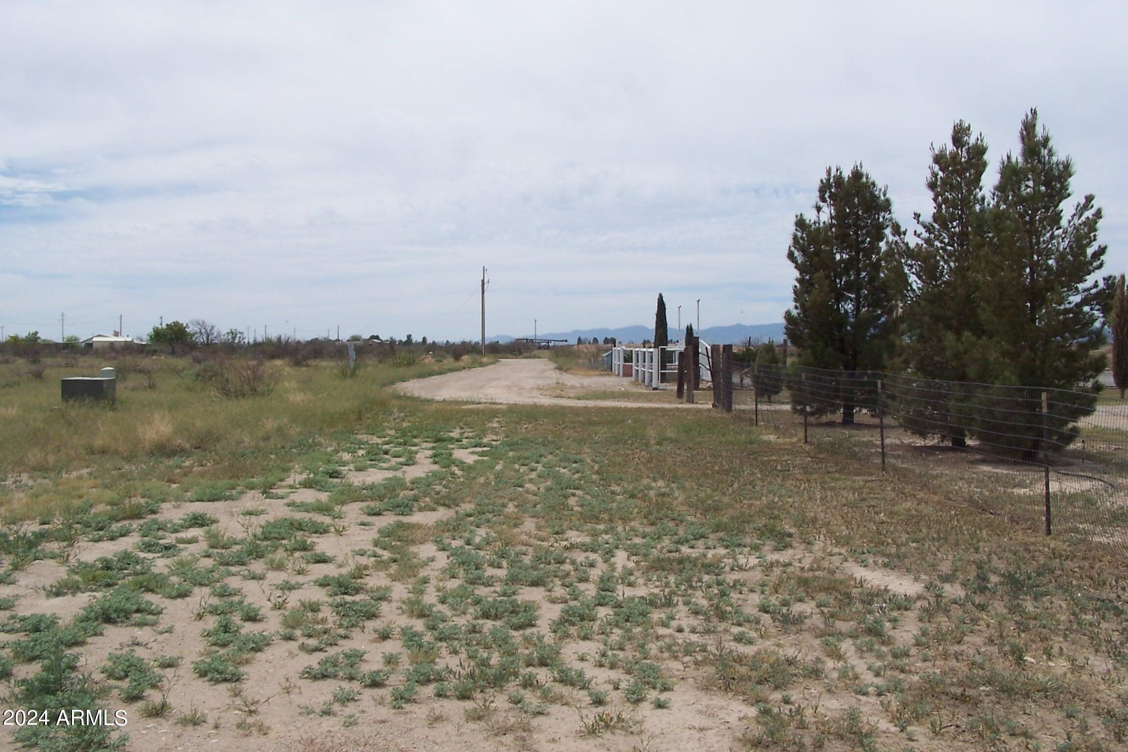 1.1-ac North 1.1-ac N Rabbit Lane Willcox, AZ 85643 - Photo 7 of 12 a view of a lake with houses in the back