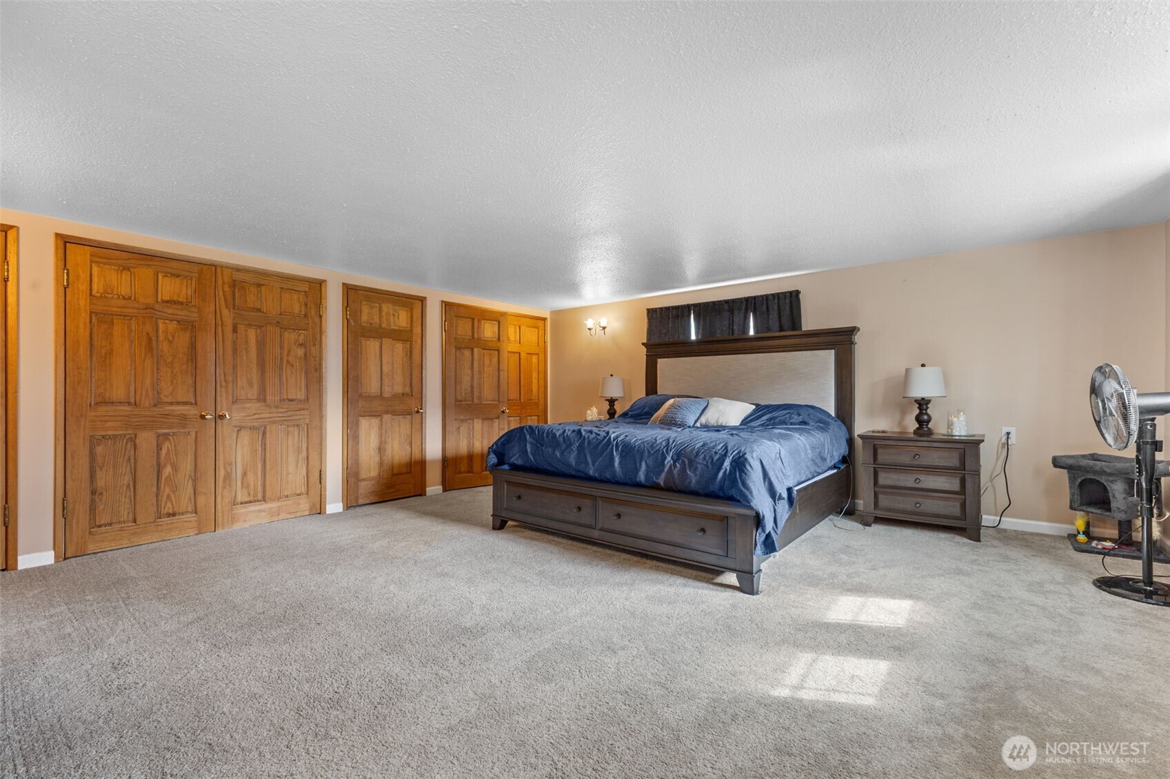 545 Davis Lake Road Morton, WA 98356 - Photo 13 of 32 a bedroom with a bed and large cabinets