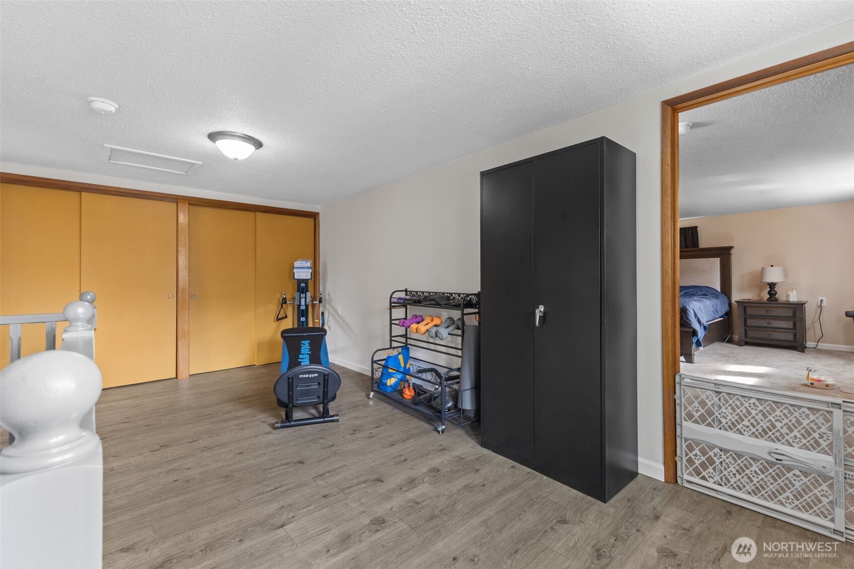 545 Davis Lake Road Morton, WA 98356 - Photo 14 of 32 a bedroom with a bed and wooden floor