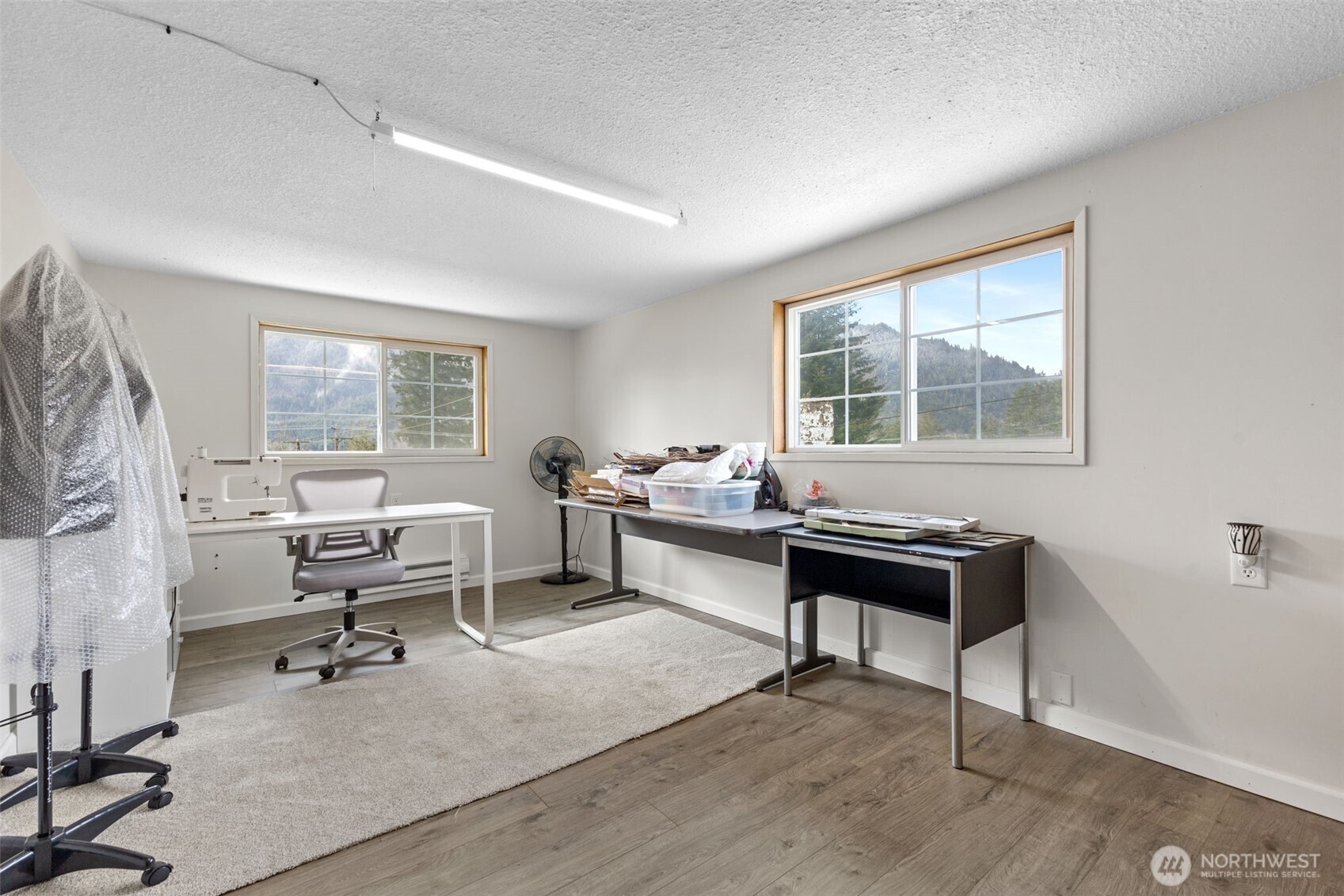 545 Davis Lake Road Morton, WA 98356 - Photo 15 of 32 a living room with furniture a rug and a window
