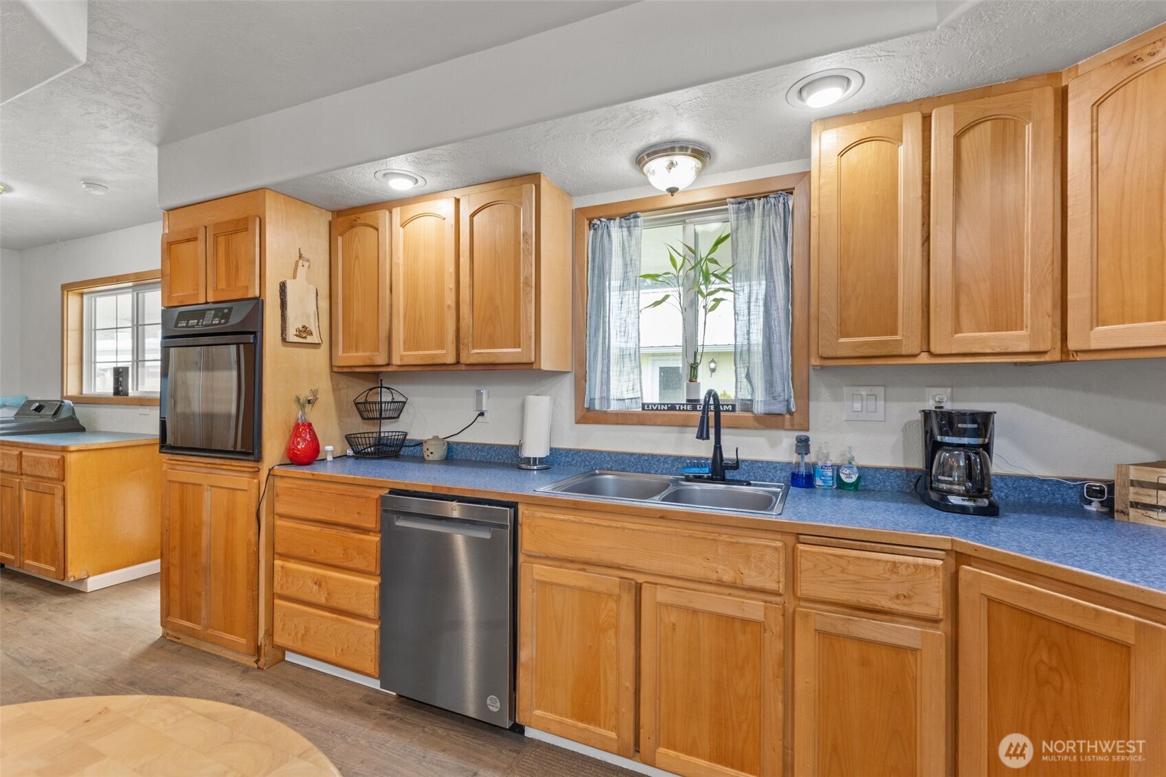 545 Davis Lake Road Morton, WA 98356 - Photo 10 of 32 a kitchen with sink a window and cabinets