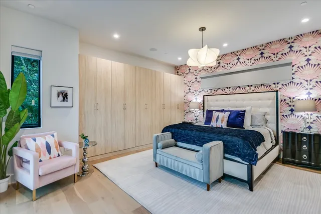 a living room with furniture and a chandelier