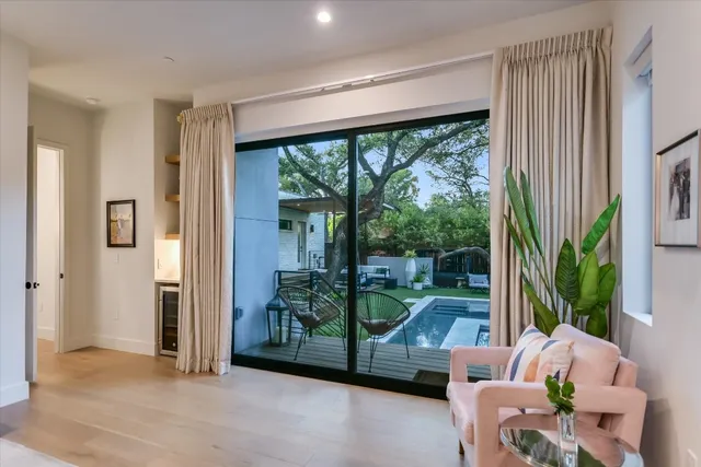 a living room with couch and a large window