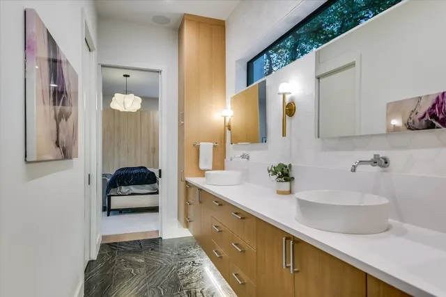 a bathroom with a sink double vanity and a mirror