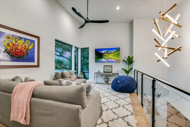 a bedroom with furniture and a large window