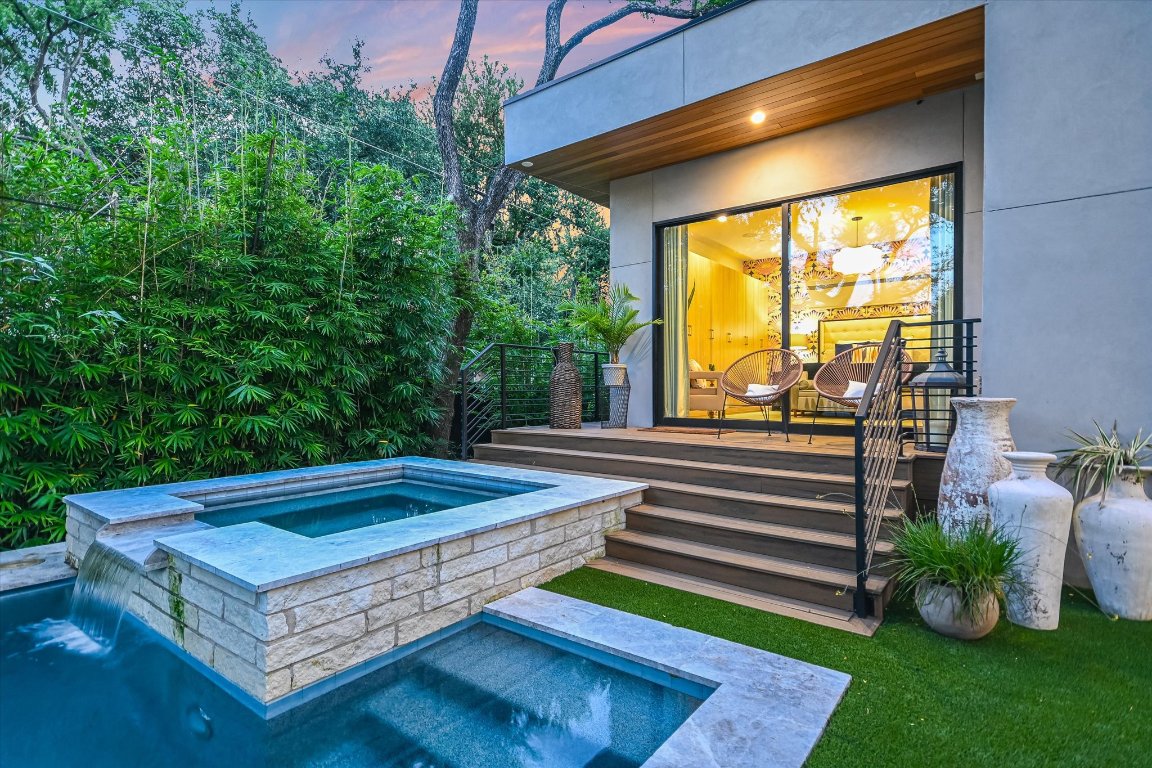 403 Ridgewood Road Austin, TX 78746 - Photo 22 of 34 a front view of a house with garden