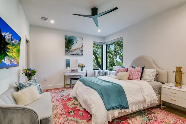 a bedroom with a bed window and couch
