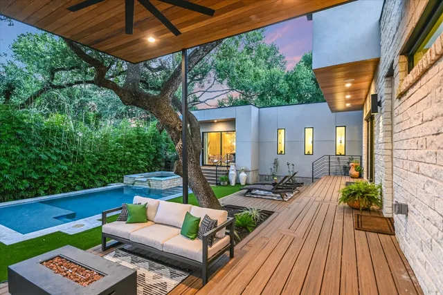a view of a couches and dinning table in patio