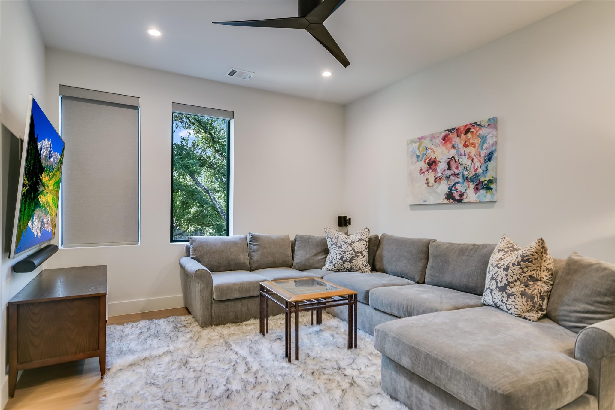 403 Ridgewood Road Austin, TX 78746 - Photo 30 of 34 a living room with furniture and a flat screen tv