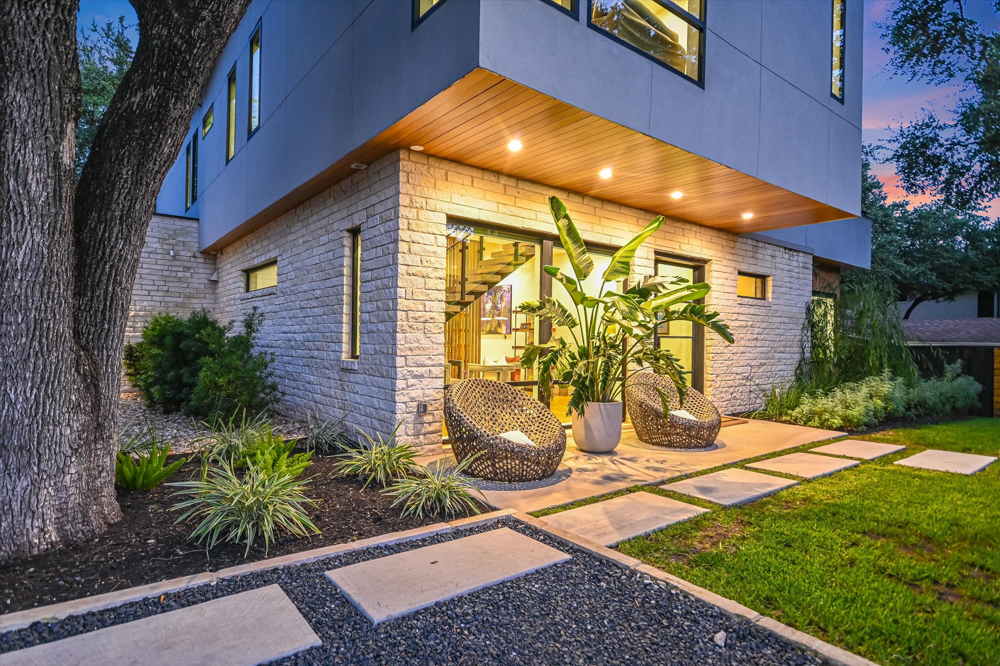 403 Ridgewood Road Austin, TX 78746 - Photo 5 of 34 a backyard of a house with potted plants and trees