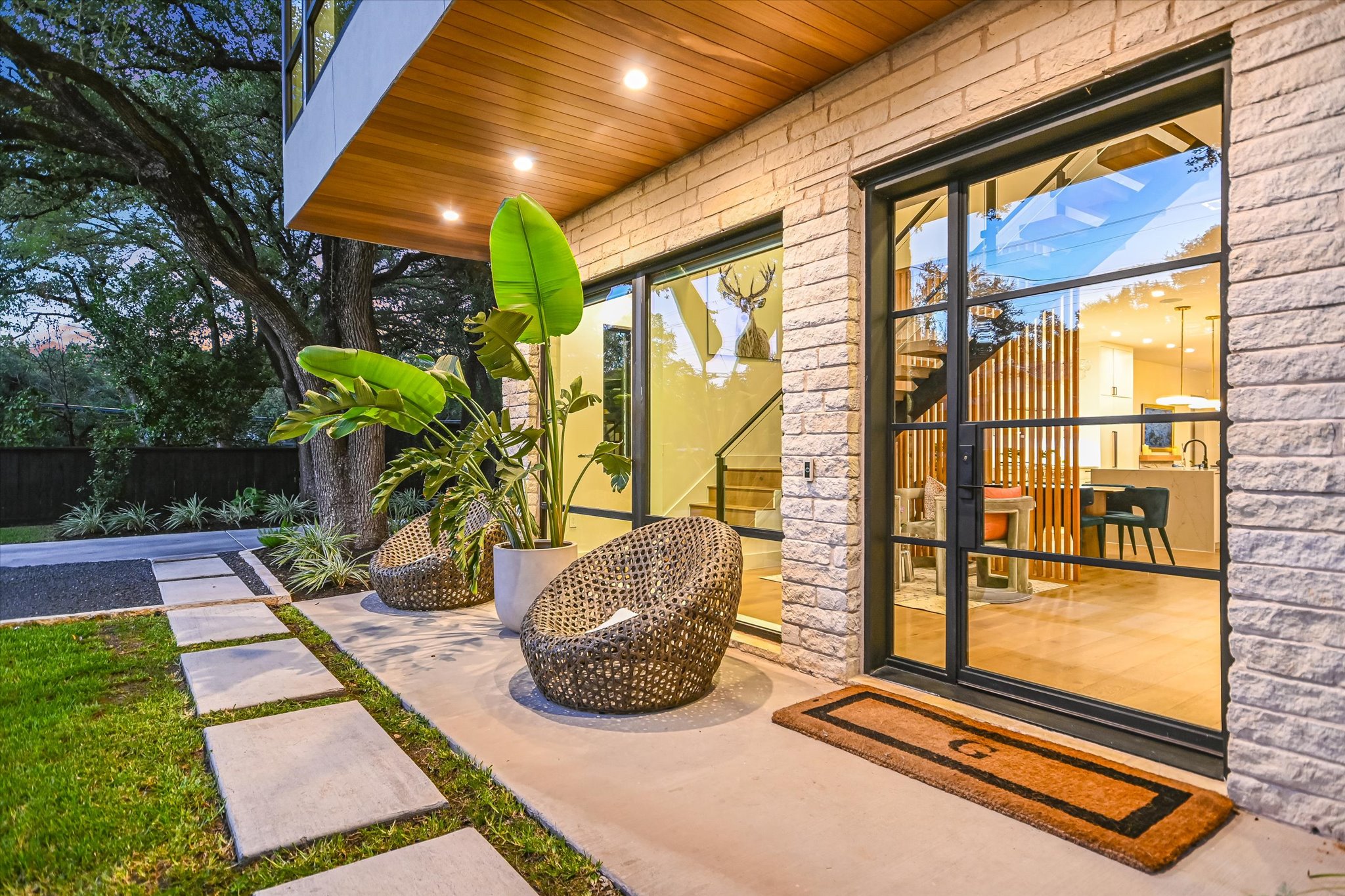 403 Ridgewood Road Austin, TX 78746 - Photo 6 of 34 a view of porch with a floor to ceiling window and potted plants