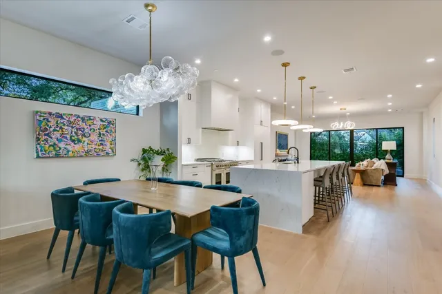 a dining room with furniture and a chandelier