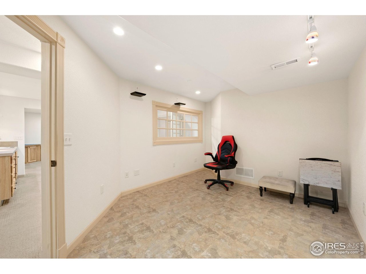6608 West 3rd Street, Unit 61 Greeley, CO 80634 - Photo 15 of 16 a living room with furniture and a window