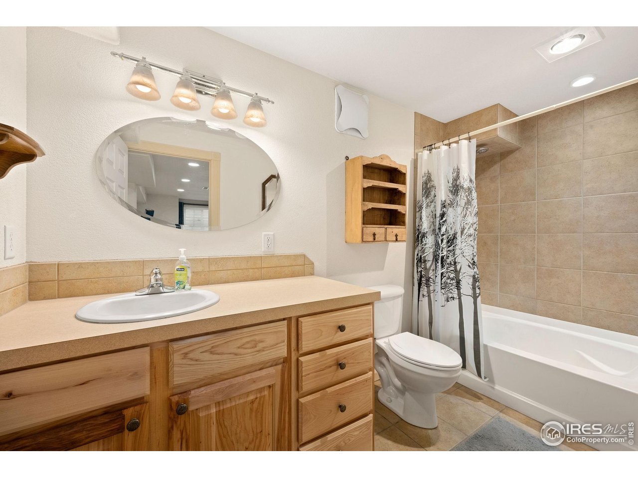6608 West 3rd Street, Unit 61 Greeley, CO 80634 - Photo 7 of 16 a bathroom with a sink a toilet and shower