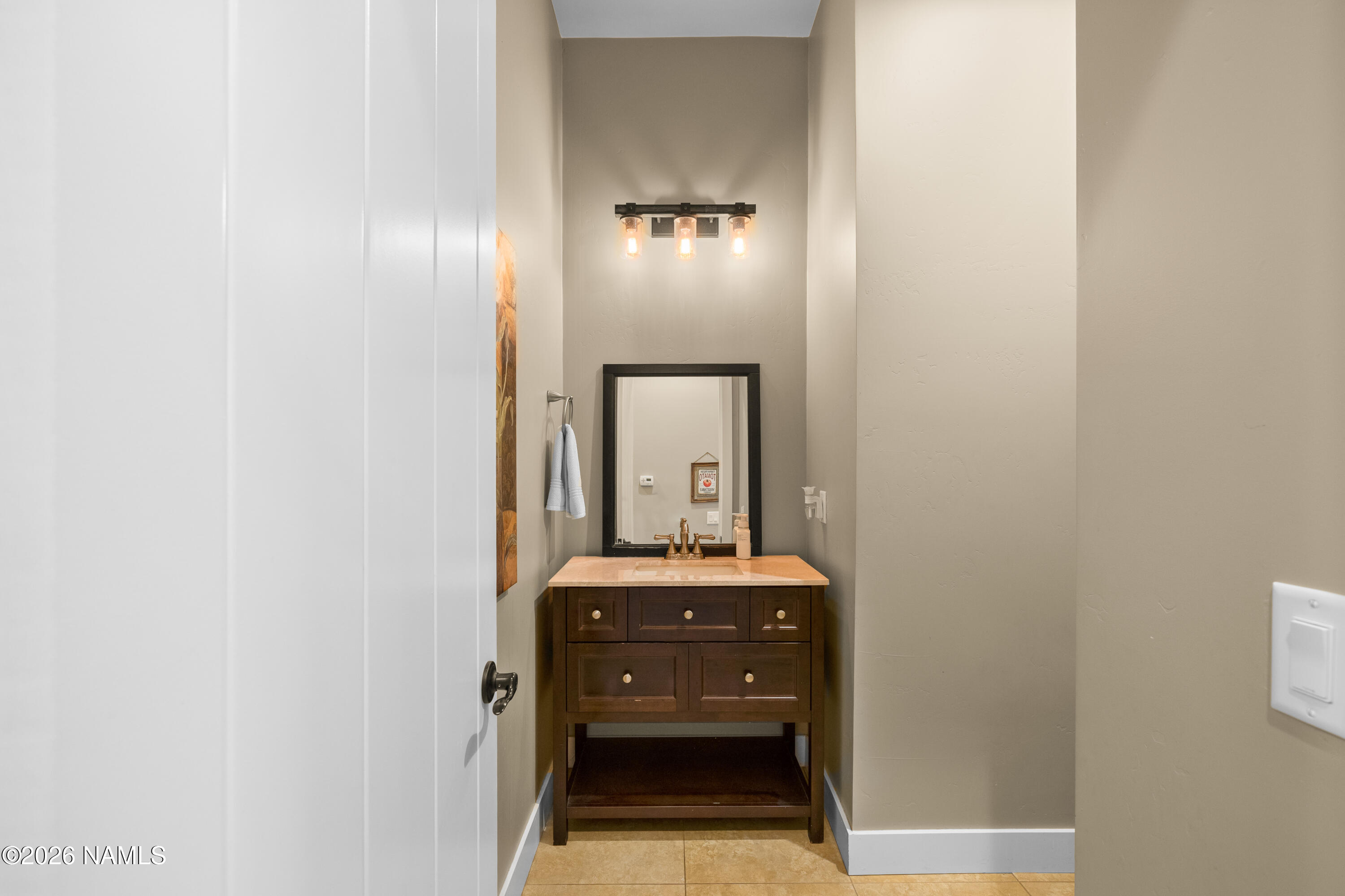 10833 Sage Road Flagstaff, AZ 86004 - Photo 16 of 45 Half bathroom main level
