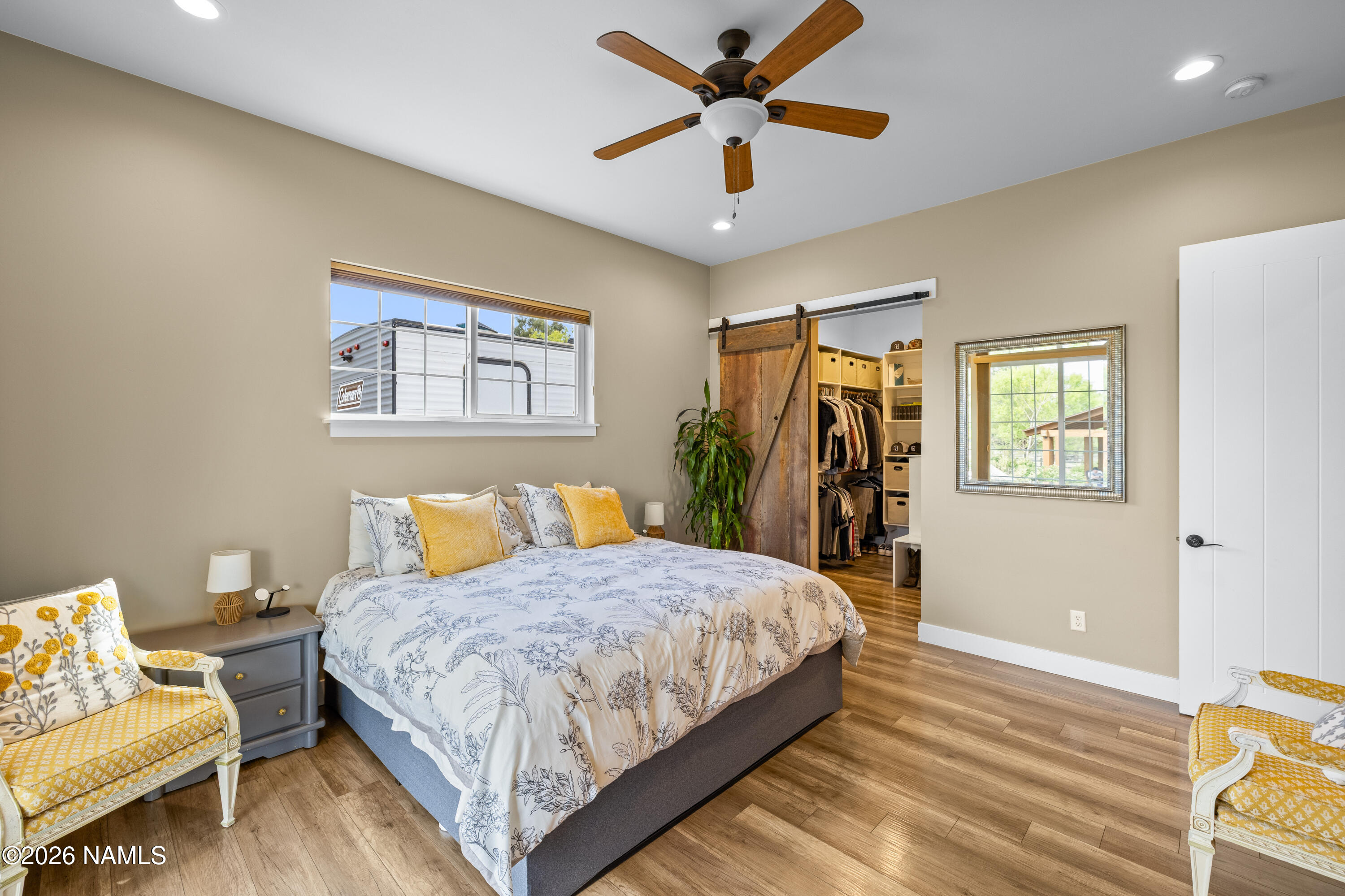10833 Sage Road Flagstaff, AZ 86004 - Photo 19 of 45 a bedroom with a bed couch and a window