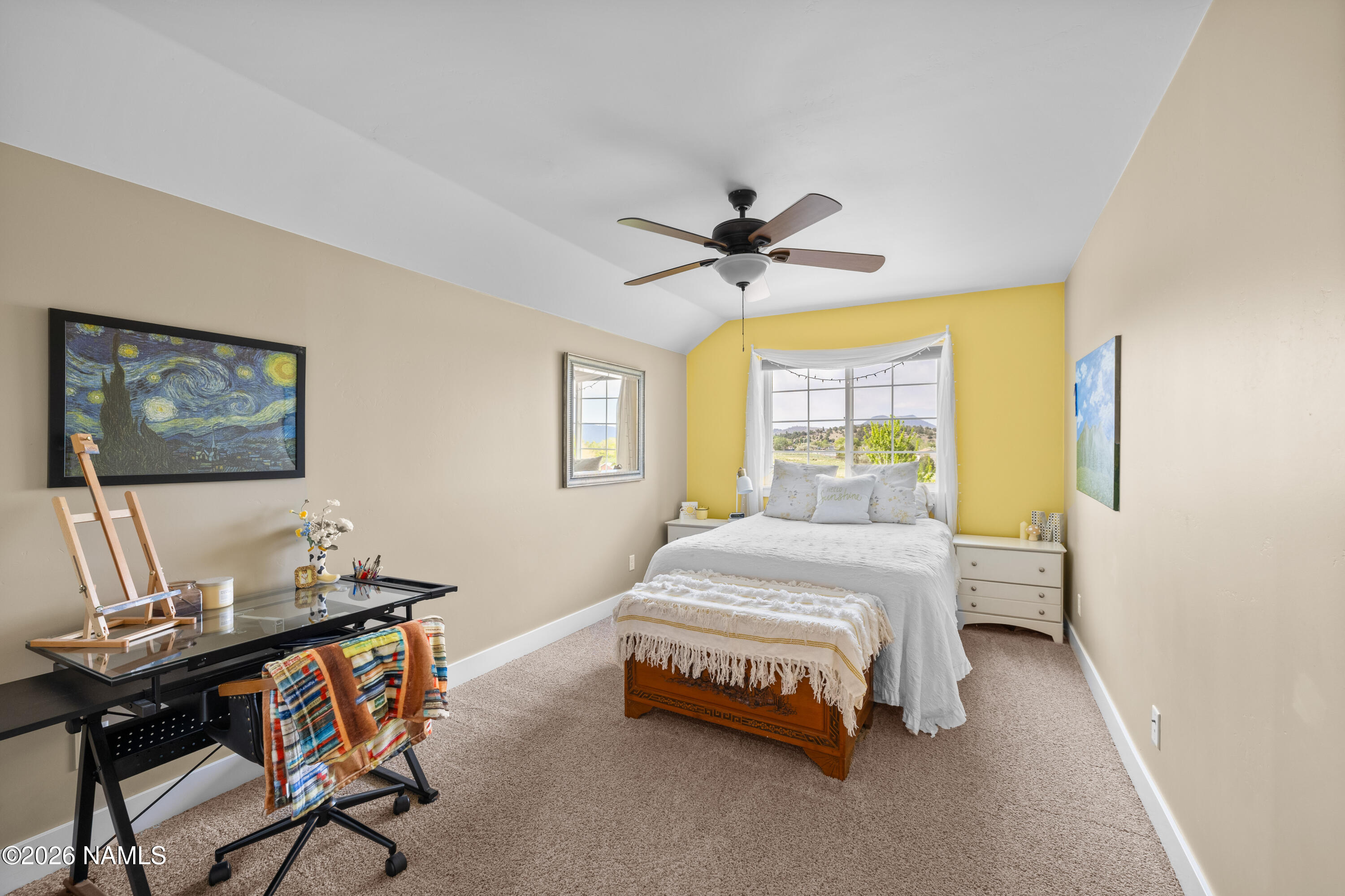 10833 Sage Road Flagstaff, AZ 86004 - Photo 27 of 45 a bed room with a bed and a window