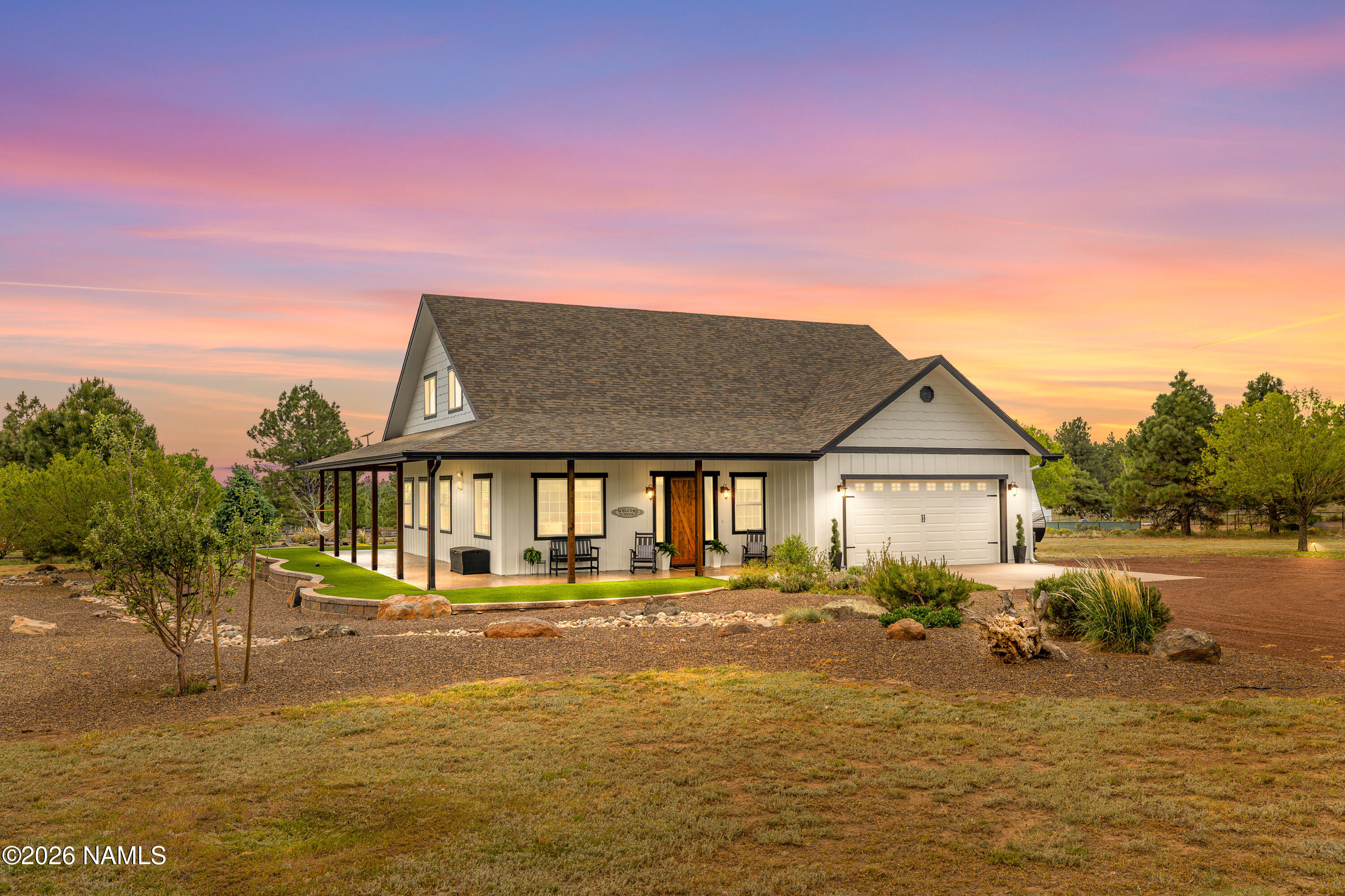 10833 Sage Road Flagstaff, AZ 86004 - Photo 3 of 45 a front view of a house with a yard