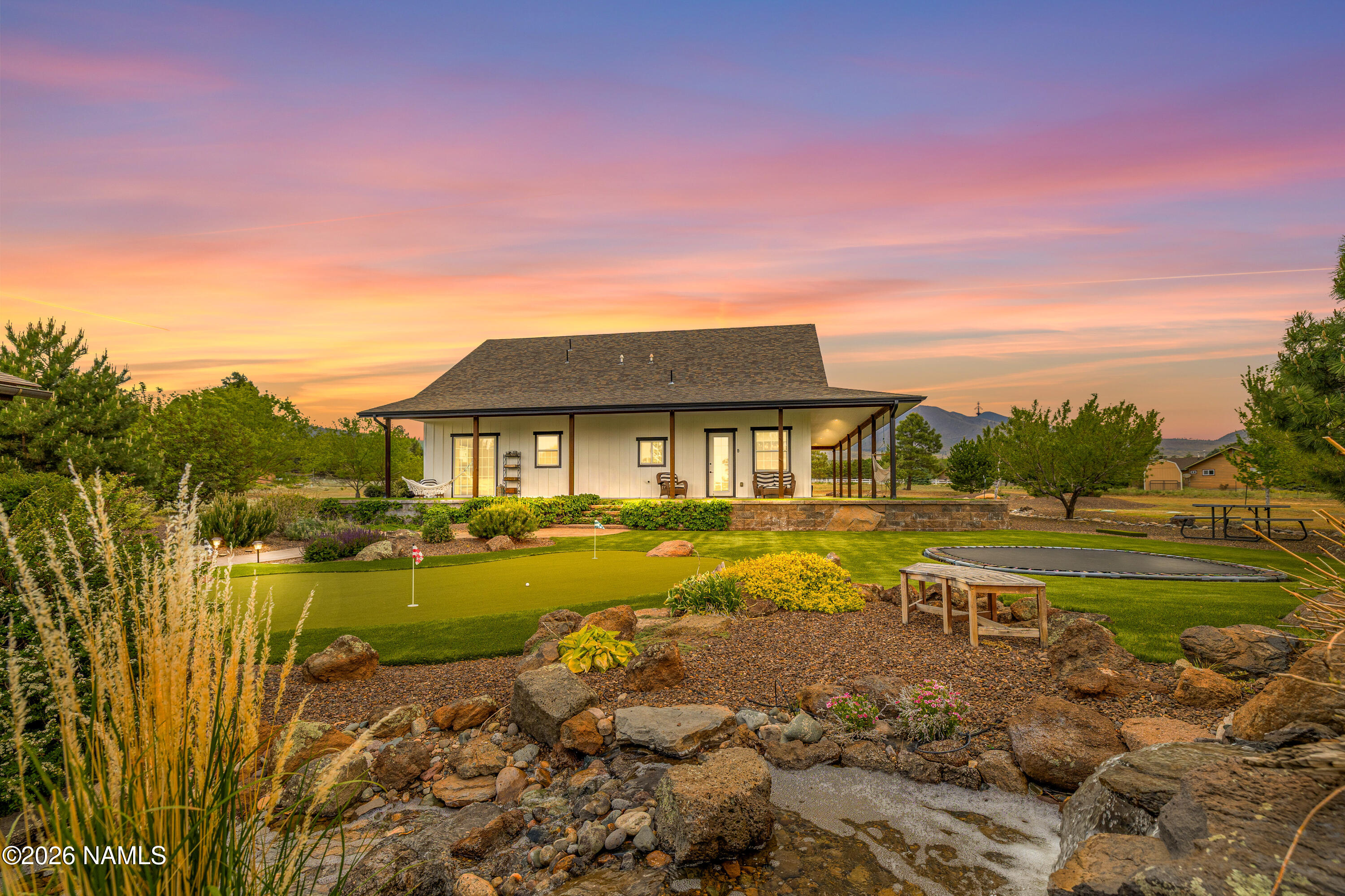 10833 Sage Road Flagstaff, AZ 86004 - Photo 31 of 45 a view of a house with pool and ocean view