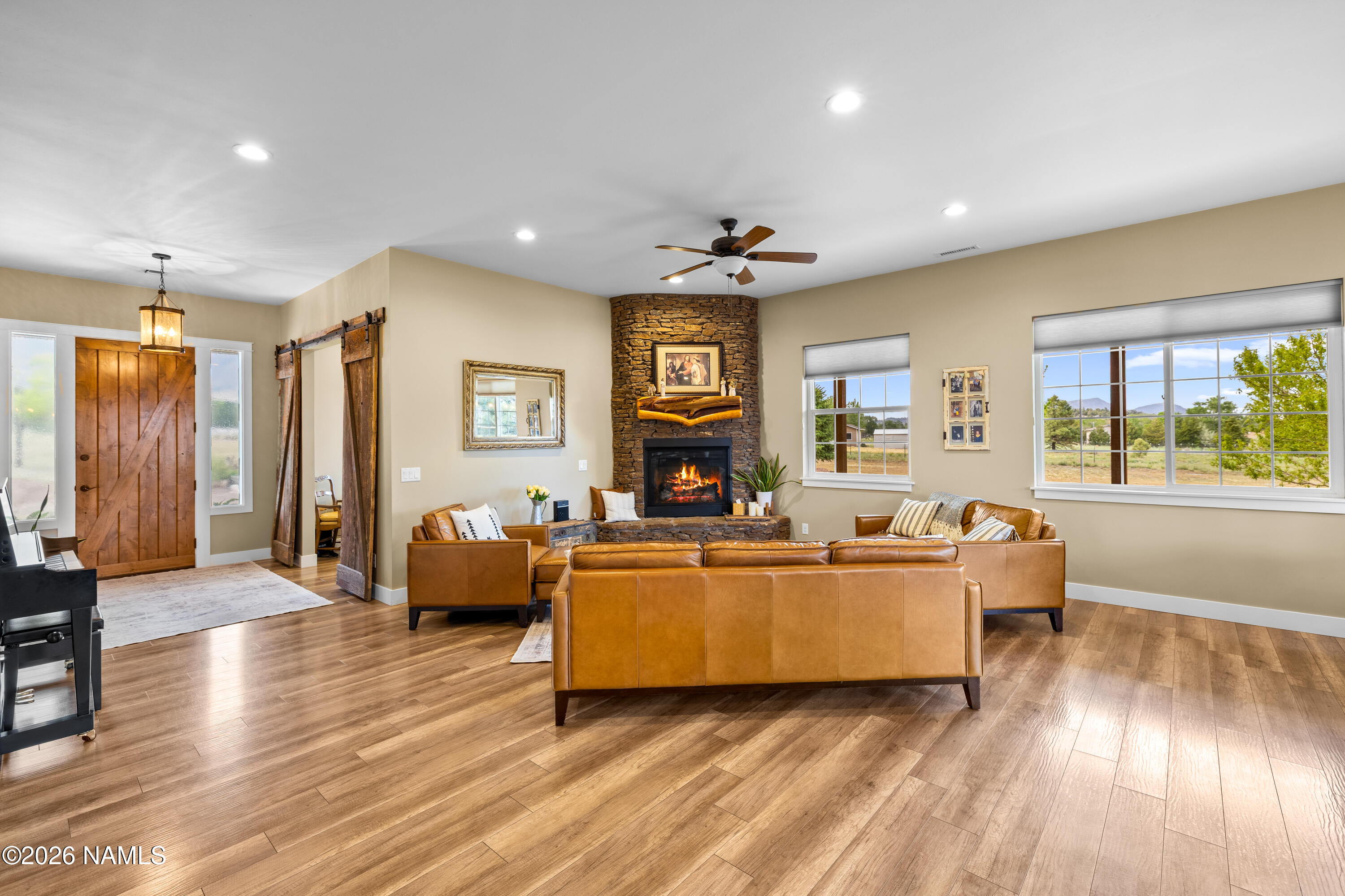 10833 Sage Road Flagstaff, AZ 86004 - Photo 9 of 45 a living room with fireplace furniture and a wooden floor