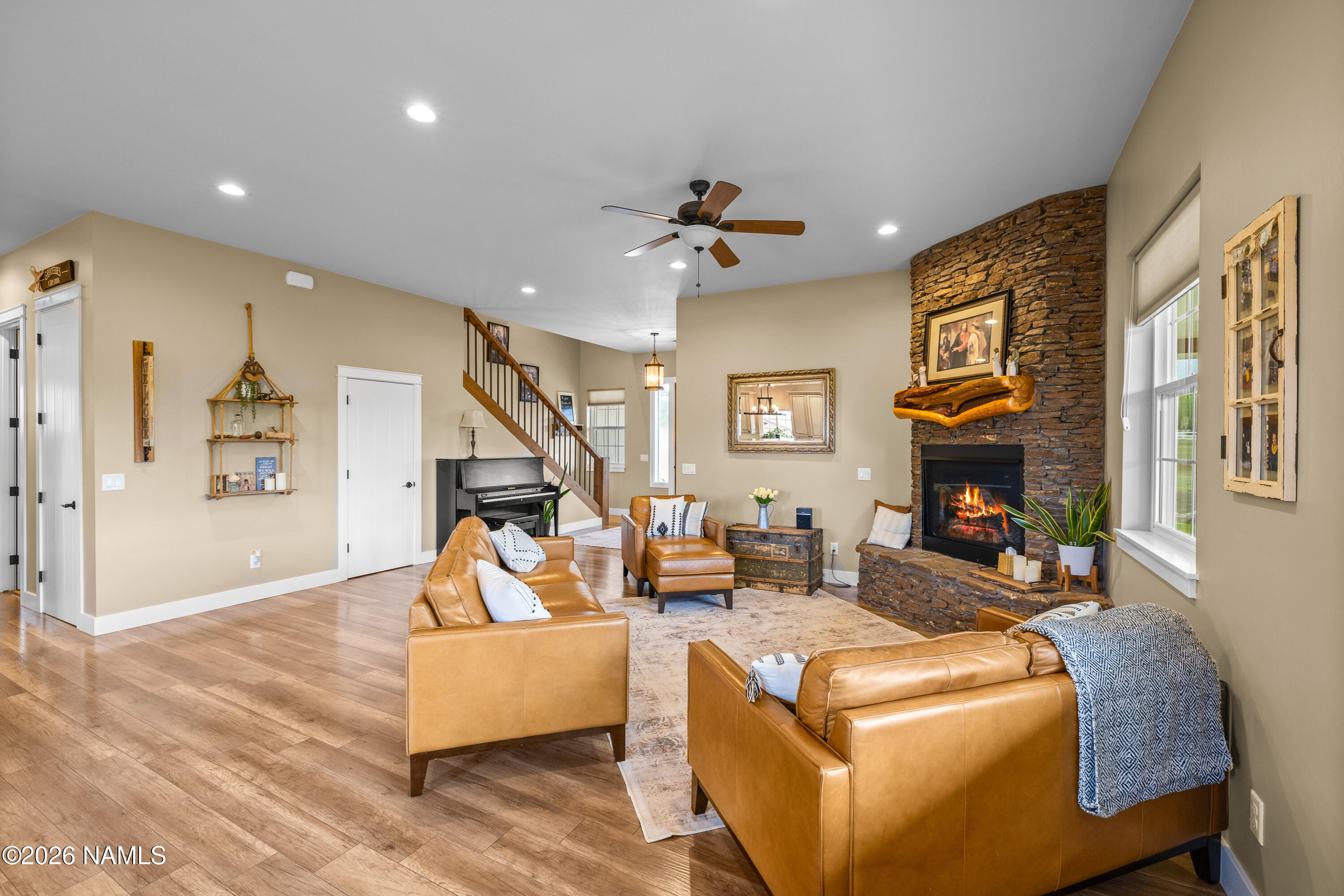 10833 Sage Road Flagstaff, AZ 86004 - Photo 10 of 45 a living room with furniture and a fireplace