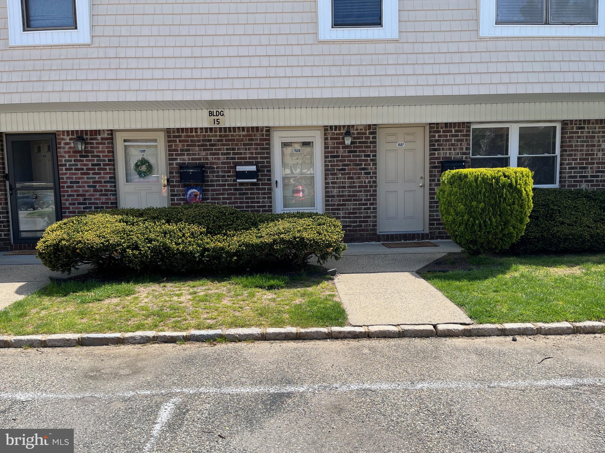 1508 Silver Court Hamilton, NJ 08690 - Photo 3 of 19 a view of a house with a small yard and a garage