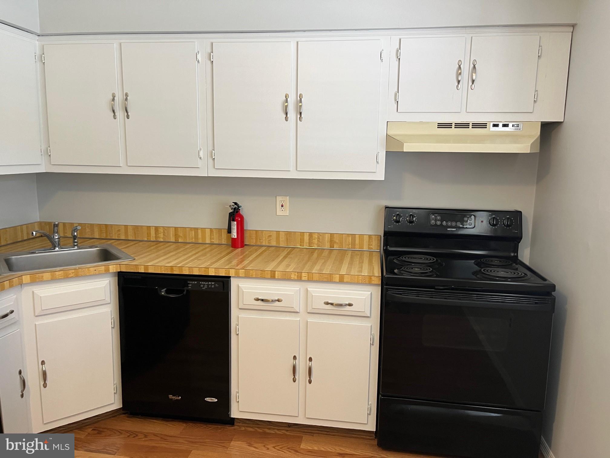 1508 Silver Court Hamilton, NJ 08690 - Photo 10 of 19 a kitchen with stainless steel appliances granite countertop a stove a sink and white cabinets