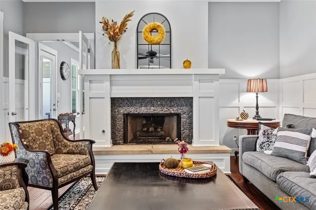 a living room with furniture and a fireplace